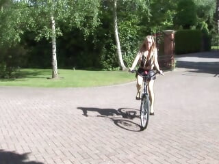 Buxom platinum-blonde gets drilled while holding her bicycle